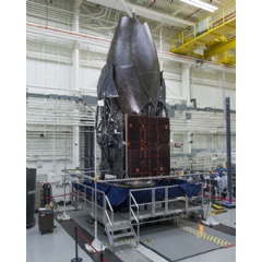 Boeing-built TDRS-M working its way through Boeings El Segundo satellite factory as it readies for launch. (Boeing photo)