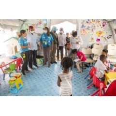 UNICEF/UN0738896/Serra. Hannan Sulieman, UNICEF Deputy Executive Director, is welcomed at the child friendly space at the Migrant Reception Centre of Lajas Blancas, Panama. (see complete caption below)