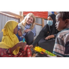 UNICEF/UN0631310/Sewunet, On 26 April 2022, UNICEF Executive Director Catherine Russell interacts with children at a child-friendly space supported by UNICEF at Higlo Internally Displaced Persons (IDP) site in Ethiopia.