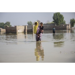 UNICEF/UN0730486/Bashir
A woman holds her daughter as she stands in floodwaters in Sindh Province, Pakistan.