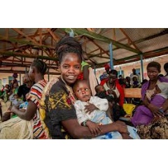 A South Sudanese refugee and her grandchild at one of eight health facilities in Kenyas Kalobeyei settlement.    UNHCR/Pauline Omagwa