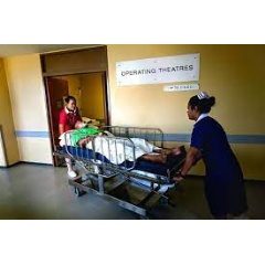 WHO / Yoshi Shimizu
An emergency care patient being moved to operating theatre by nurses
