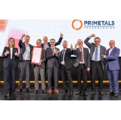 The winning team from Primetals Technologies, celebrating on stage during the ceremony for the National Prize for Innovation in Vienna.