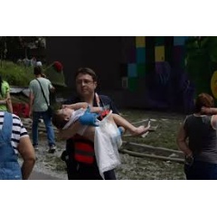 UNICEF/UNI608726/Filippov
On 8 July 2024 in Kyiv, a rescue worker carries a child as first responders, hospital staff and volunteers clear the rubble and search for people trapped under debris (see complete caption below)