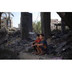 UNICEF/UNI485696/Eyad El Baba
Two Palestinian children sitting in the rubble of what is left of their house in Rafah city, southern the Gaza Strip.