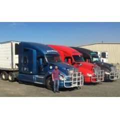 Matt Blinsky, vice president of Floyd Blinsky Trucking, is shown with three of the companys Kenworth T680s with 76-inch sleepers, the Drivers Studio, and PACCAR MX-13 engines.