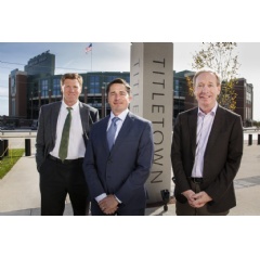 Mark Murphy, president & CEO, Green Bay Packers; Ed Policy, vice president & general counsel, Green Bay Packers; and Brad Smith, president, Microsoft, [pictured left-to-right] in Green Bays Titletown District, adjacent Lambeau Field