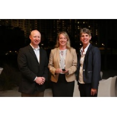 Eganne Wolfington of Wolfington Body Company, Inc. accepts the 2017 Dealer of the Year award. She is flanked from Left to Right, by Ryan Kauffman (VP Sales, IC Bus) and Trish Reed (GM & VP, IC Bus).
