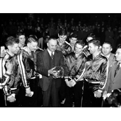 University of Kentucky basketball coach Adolph Rupp and his team admire the NCAA basketball title cup after defeating Oklahoma A&M 46-36 in Seattle in March 1949, which was the first year of the AP mens basketball poll.
(AP Photo/Paul Wagner)