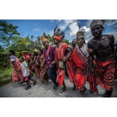 South Sorong Regional Secretary Dance Nauw (center) walks as he is welcomed with a traditional dance from the community during a ceremony in Teminabuan, South Sorong, Southwest Papua. 
Credit line:  Jurnasyanto Sukarno / Greenpeace