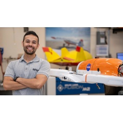 Felipe Valdez, a NASA engineer at Armstrong Flight Research Centers Dale Reed Subscale Flight Research Laboratory, stands next to a subscale model of the Hybrid Quadrotor (HQ-90) aircraft.
NASA / Charles Genaro Vavuris