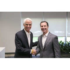 Congressman Charlie Crist (l) meets with Harris Corporation Chairman, President and CEO Bill Brown (r) during a visit to the companys Global Innovation Center in Melbourne, Florida.