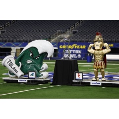 A tradition since 2016, title sponsor Goodyear commissioned artist, Blake McFarland, to create tire mascot sculptures of the University of Southern California and Tulane mascots. (see complete caption below)