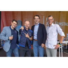 BMW Group Anniversary Days (7/2023) German comedian Willy Astor receives his new work clothes from Milan Nedelkovic, (see com plete caption below)